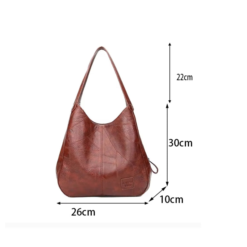Infográfico detalhando as dimensões de 26cm de largura por 30cm de altura da Bolsa Maré.