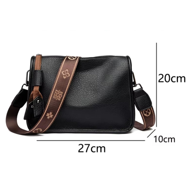 Infográfico detalhando as dimensões de 27cm de comprimento por 20cm de altura da Bolsa Charlotte.