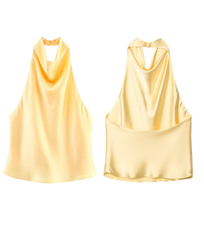 Tecido acetinado da blusa feminina amarela com brilho suave e caimento elegante.
