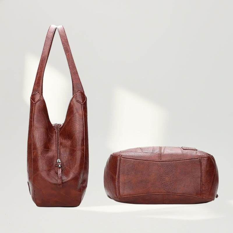 Modelo utilizando a Bolsa Maré Vintage Brown em ambiente externo, destacando versatilidade.