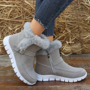 Bota feminina cinza com solado branco esportivo em perfil
