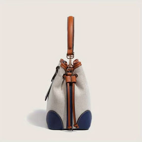 bolsa transversal feminina em lona azul com alça ajustável