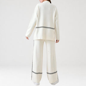 modelo de costas apresentando conjunto feminino em malha premium com listras contrastantes e estilo minimalista elegante