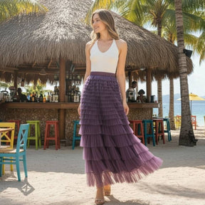 Detalhe em close da textura delicada do tule macio lilas e acabamento das camadas franzidas