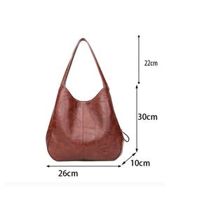 Infográfico detalhando as dimensões de 26cm de largura por 30cm de altura da Bolsa Maré.