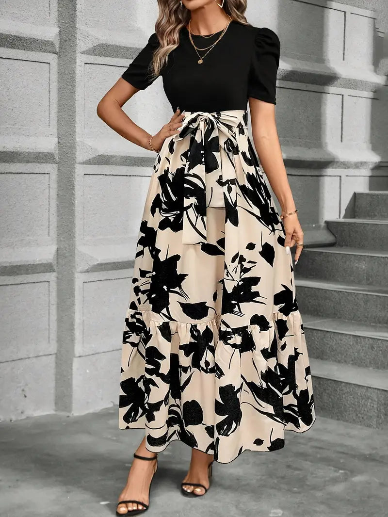 vestido bege floral com corpo preto
